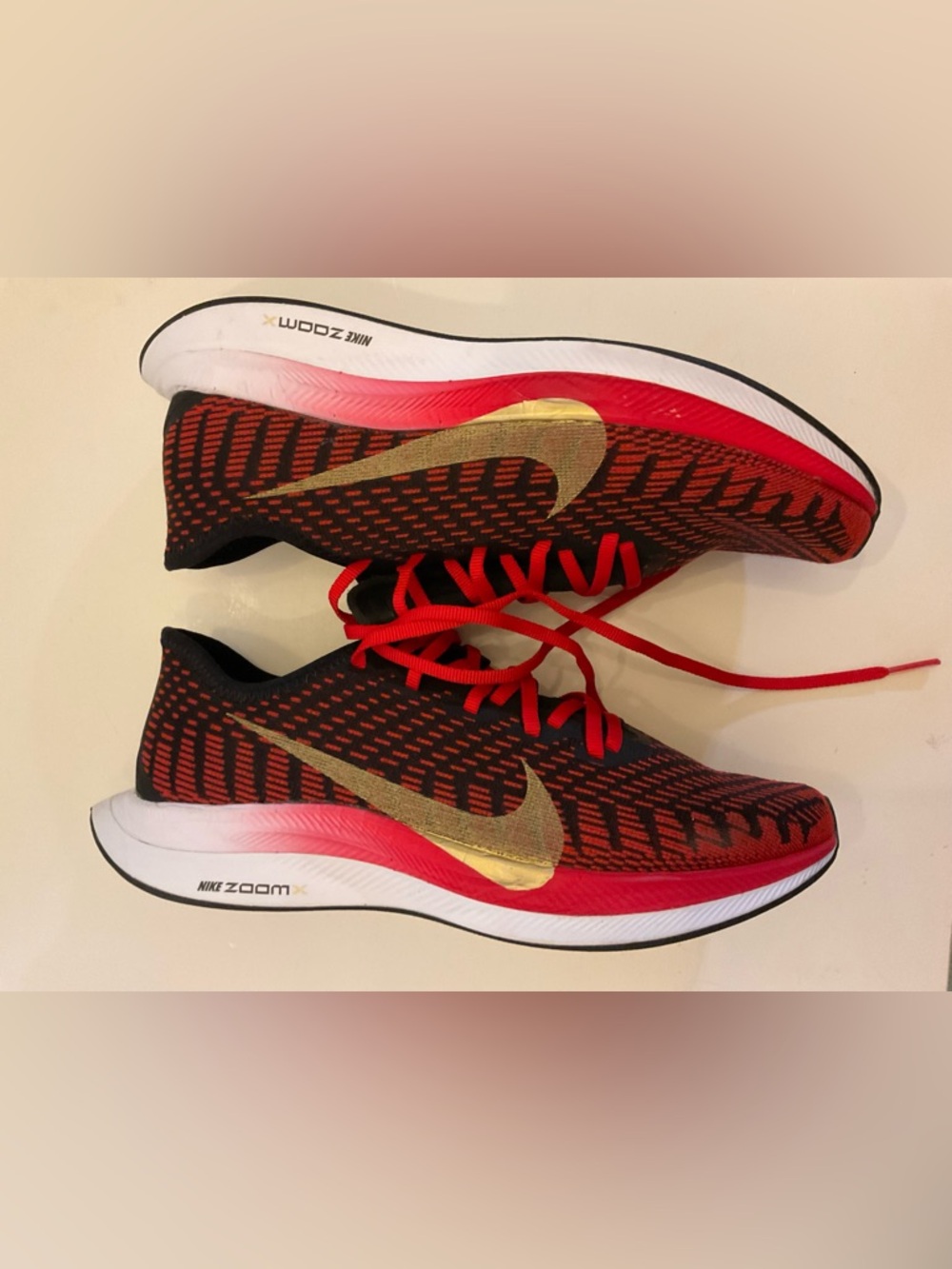 Nike Black and Red Running Shoes with Gold Swoosh